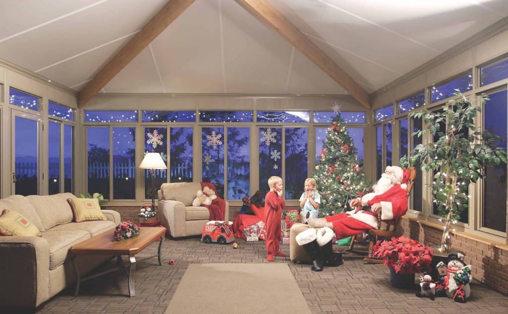 family celebrates merry christmas in christmas sun room