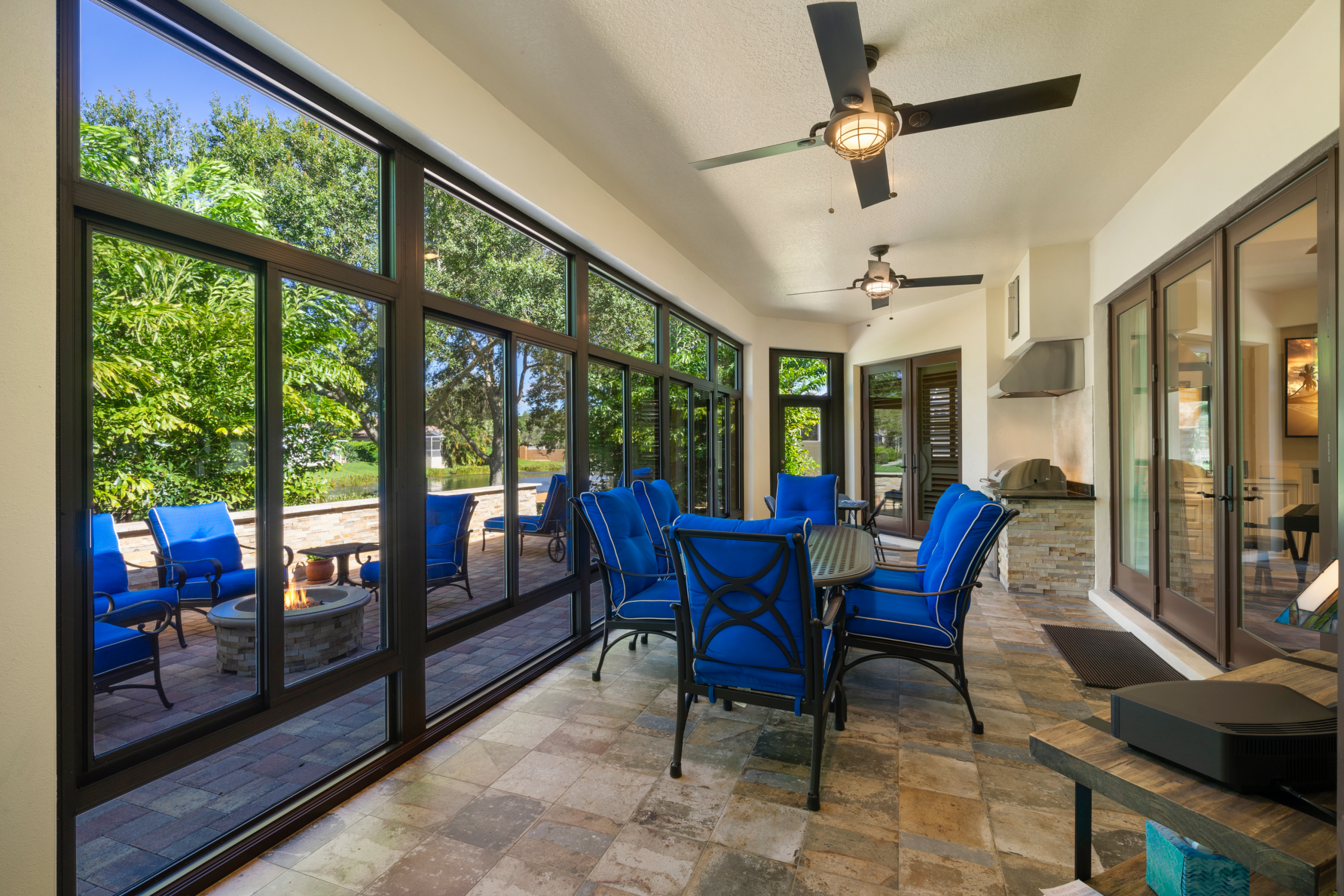 modern glass sunroom with full-view swing doors, uv-protected insulated glass, backyard views, indoor comfort meets outdoor style 